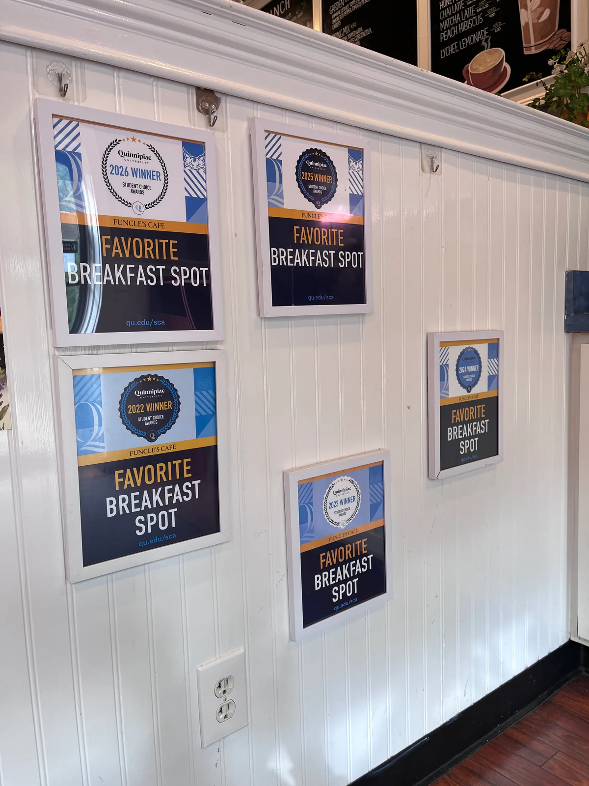Funcle’s Café Favorite Breakfast Spot awards displayed on the wall.